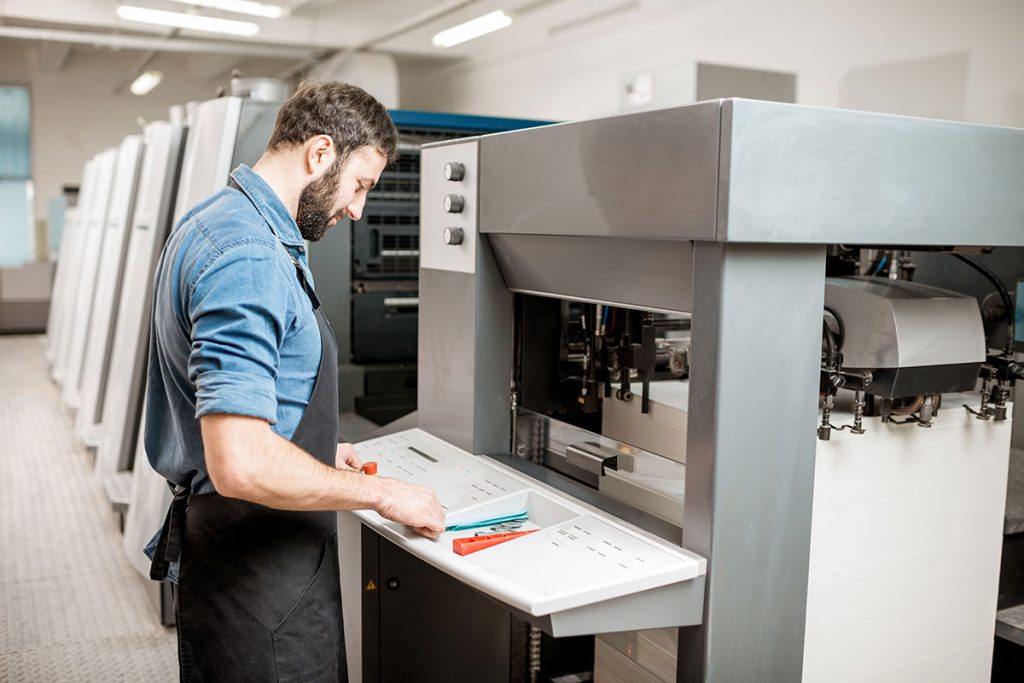 a printer operator working at a printer